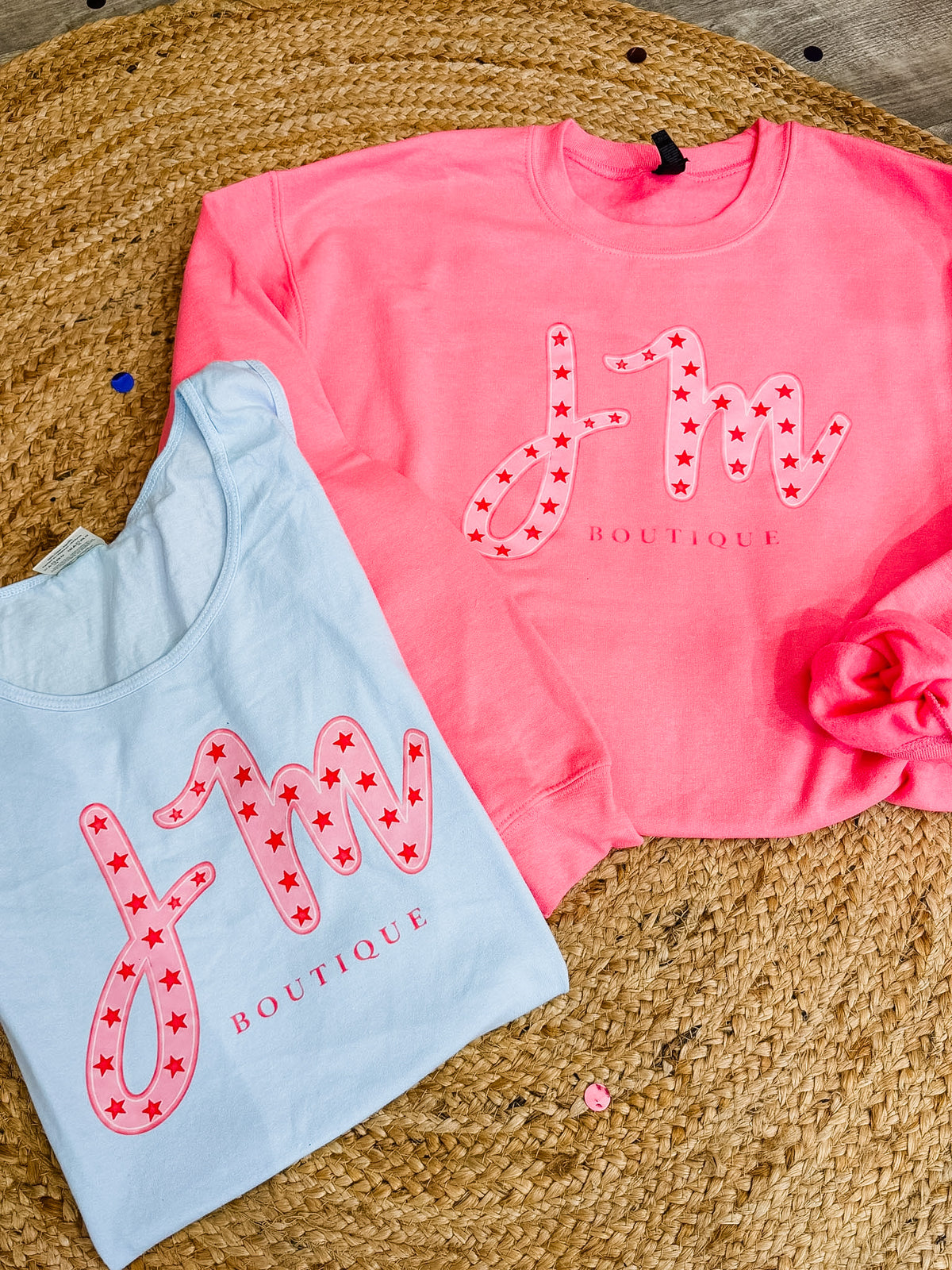 Pink and light blue JM birthday sweatshirts