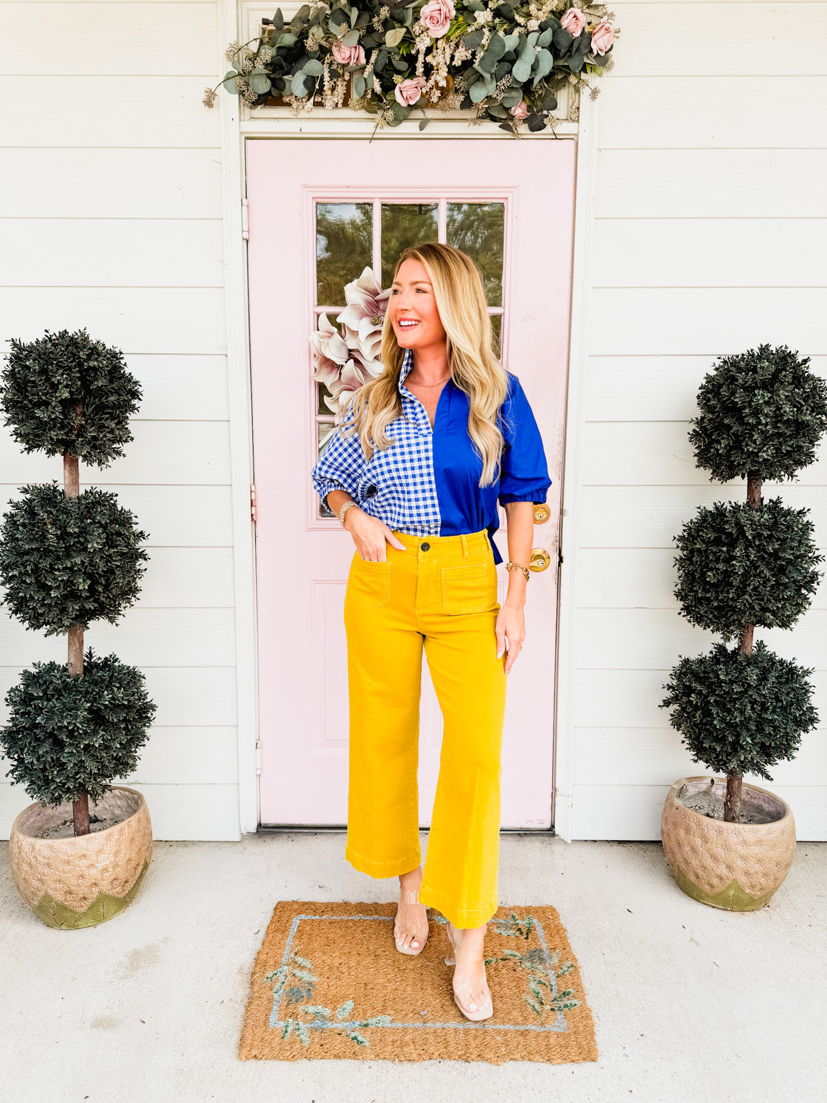 Gold wide-leg jeans styled with a blue top