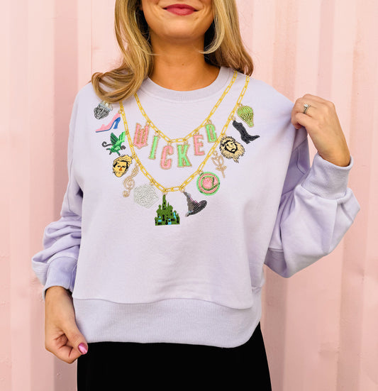 Licensed Wicked x Queen Of Sparkles Lavender Wicked Charm Necklace Sweatshirt